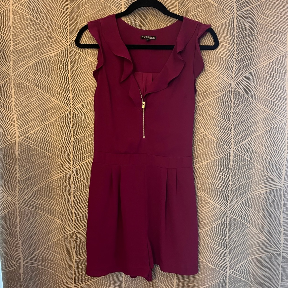 Express Plum romper with zipper and ruffle